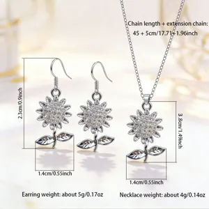 Silver sunflower necklace and earrings jewelry set with sparkling rhinestones, elegant floral design.