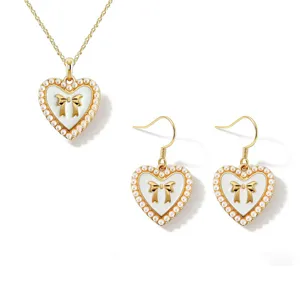 Chic heart pearl bow necklace earrings set, elegant gold-plated jewelry for daily wear.