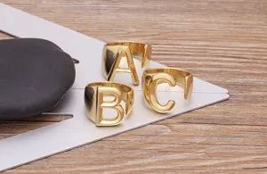 Gold plated alphabet letter rings featuring bold initial designs A B C, stylish open ring.