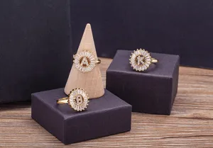 Gold-plated CZ initial letter ring, elegant baguette cubic zirconia circular ring jewelry.