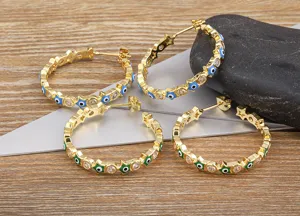 Gold plated evil eye hoop earrings with sparkling zirconia and star design for women fashion.