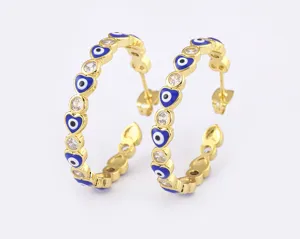 Gold plated evil eye heart hoop earrings detail, featuring sparkling cubic zirconia stones.