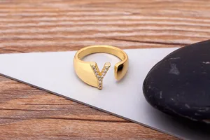 Close-up detail of the 18K gold plated open letter Y ring paved with sparkling cubic zirconia.