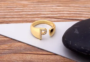 Detailed view of the 18k gold plated open initial letter P zircon ring, stylish knuckle ring.