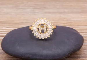 Gold plated letter H zircon ring detail shot showcasing the elegant circular crystal cluster design.