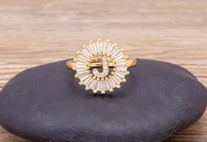 Gold plated initial letter J cubic zirconia ring detail shot showcasing sparkling clear stones.