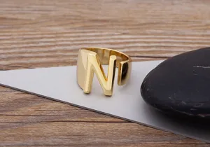 Gold letter N ring detail shot showing the polished metallic surface and open band.