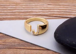 Gold plated open letter J ring with sparkling zircon stones for stylish daily wear.
