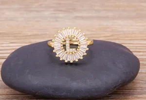 18k gold plated initial letter ring with sparkling white cubic zirconia halo fashion.
