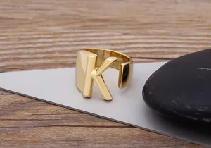 Close-up detail shot of the 18K gold plated open letter K ring showcasing polished metal finish.