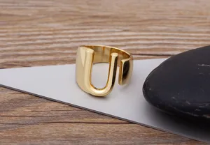 Gold plated letter U adjustable ring close-up, minimalist geometric design for daily wear.