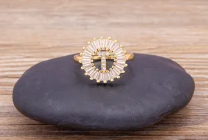Gold plated initial letter zircon ring detail, sparkling white crystal halo design accessory.