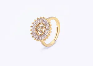 Detailed shot of gold-plated brass letter A zircon ring with sparkling baguette crystals.