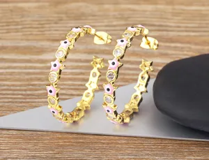Gold plated evil eye star hoop earrings for women, stylish cubic zirconia jewelry detail view.