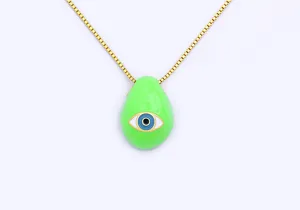 Close-up of gold plated evil eye pendant necklace with green teardrop enamel charm detail.