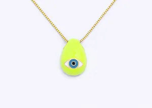 Close-up detail of a neon green evil eye pendant necklace with a gold plated chain.