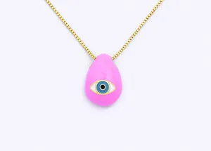 Close-up detail of a gold plated box chain necklace featuring a pink enamel evil eye pendant.
