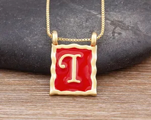 Gold-plated square letter T pendant necklace with red enamel design for women and girls.
