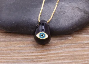 Exquisite 18K gold plated evil eye pendant necklace with black teardrop drip oil design.