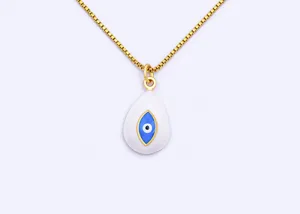 Gold plated evil eye necklace with white teardrop pendant, trendy fashion jewelry accessory.