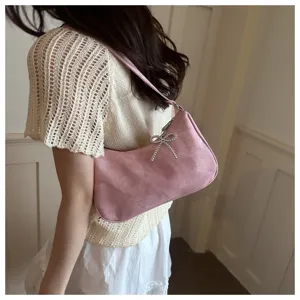 Pink shoulder underarm handbag with rhinestone bow, stylish commuter bag for women daily use.