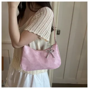 Pink underarm shoulder bag for women with sparkling bead bow pendant stylish daily commute handbag