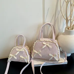 Rosa Pünktchen Schleife Muschel Handtasche und Umhängetasche mit feinem Spitzenbesatz für Damen.