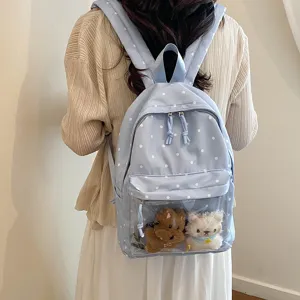 Casual sweet light blue polka dot backpack with clear front pocket, trendy student bookbag.