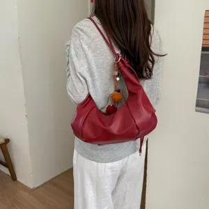 Red pleated hobo shoulder bag for women, stylish faux leather casual dumpling purse.
