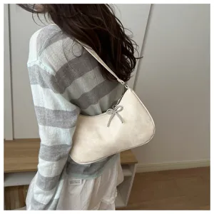Beaded bow shoulder bag for women, chic solid color commute underarm PU handbag.