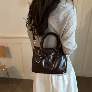 Stylish solid color dark brown faux leather shoulder bag with vintage buckle for women