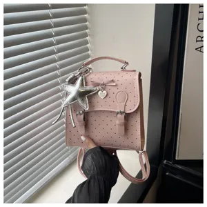 Pink polka dot mini backpack detail, sweet bow and star pendant, cute daily casual school bag.