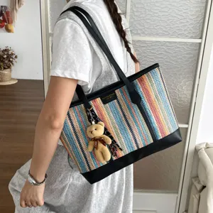 Fashion woven tote bag for women, large capacity shoulder handbag for daily commuting and travel use.