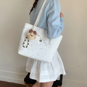 White star print tote bag with cute bow and plush bear pendant, casual shoulder handbag for women.