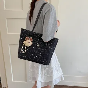 Fashionable large capacity star print tote bag with bow and cute bear pendant for women daily use.