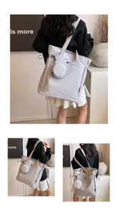 Detail view of the large capacity grey tote bag featuring a cute round coin purse accessory.