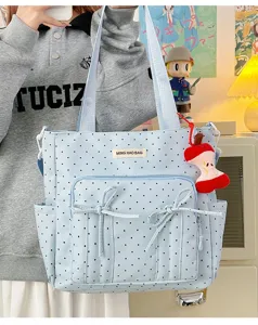Bolso tote de lunares azul claro con bolsillos frontales y lindo lazo, bolso informal.