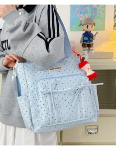 Bonito bolso tote de lona de lunares azul claro con lazos frontales y gran capacidad.