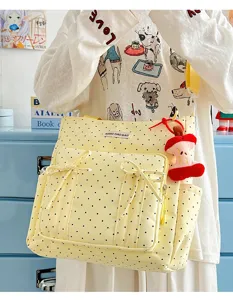 Bolso tote de lona de lunares amarillos con lazos bonitos y colgante de manzana.