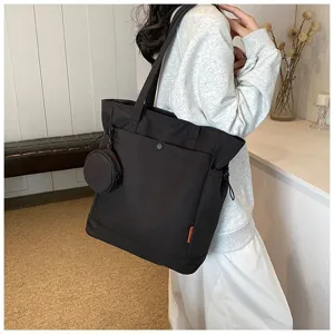 Detail view of a large capacity black tote bag with coin purse, ideal for daily and yoga use.