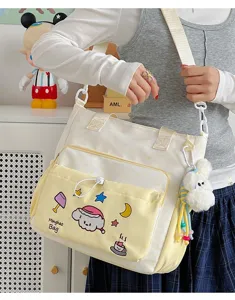 Niedliche Canvas Umhängetasche für Damen, frische Stil Schultertasche mit süßer Cartoon Stickerei.