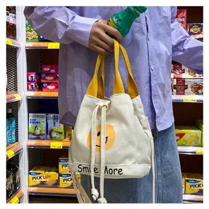 Lässige Canvas-Eimer-Tasche mit gelbem Smiley-Druck, stilvolle und süße Damentasche.