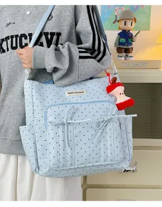 Bonito bolso de lona con lunares azules, lazo y colgante de manzana para la escuela.