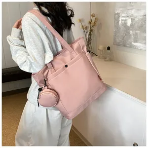Large capacity pink shoulder tote bag with coin purse, stylish women's commuter yoga bag.