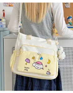 Niedliche Cartoon Canvas Umhängetasche für Schüler und Pendler mit Vordertasche Stickerei.
