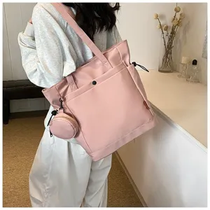 Large capacity pink canvas tote bag with a coin purse, stylish shoulder bag for women.