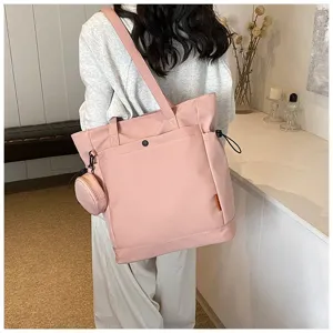 Spacious pink tote bag with shoulder strap, casual daily handbag for women, large capacity.