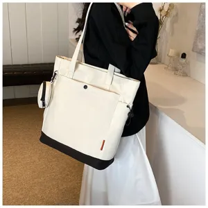 Large capacity canvas tote bag with shoulder strap, stylish women handbag for daily use.