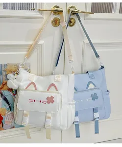 Niedliche Katzen-Umhängetasche aus Segeltuch für Damen, süße Handtasche mit Plüsch-Anhänger.