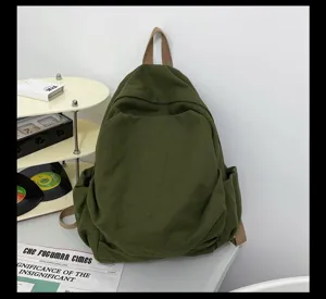 Minimalistischer dunkelgruener Canvas Rucksack, japanischer Retro Schulrucksack fuer Damen.